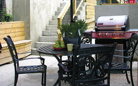 Gerstein Crisis Centre Bloor Street West location outdoor patio with table, chairs and a barbecue 