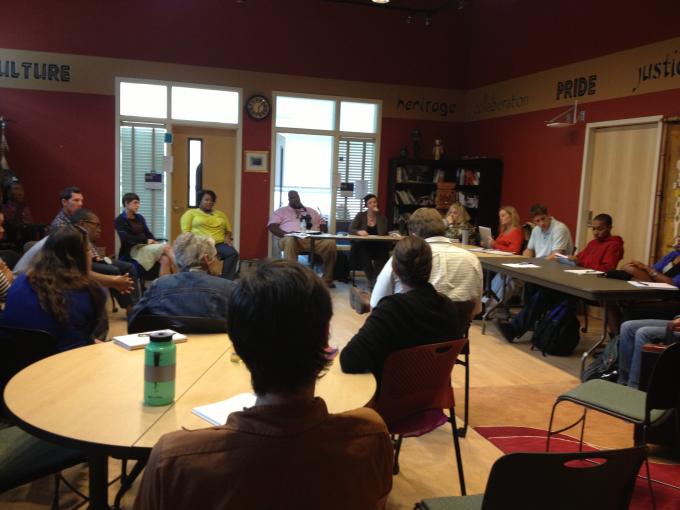 Group of people at a Gerstein Crisis Centre workshop sitting around tables 